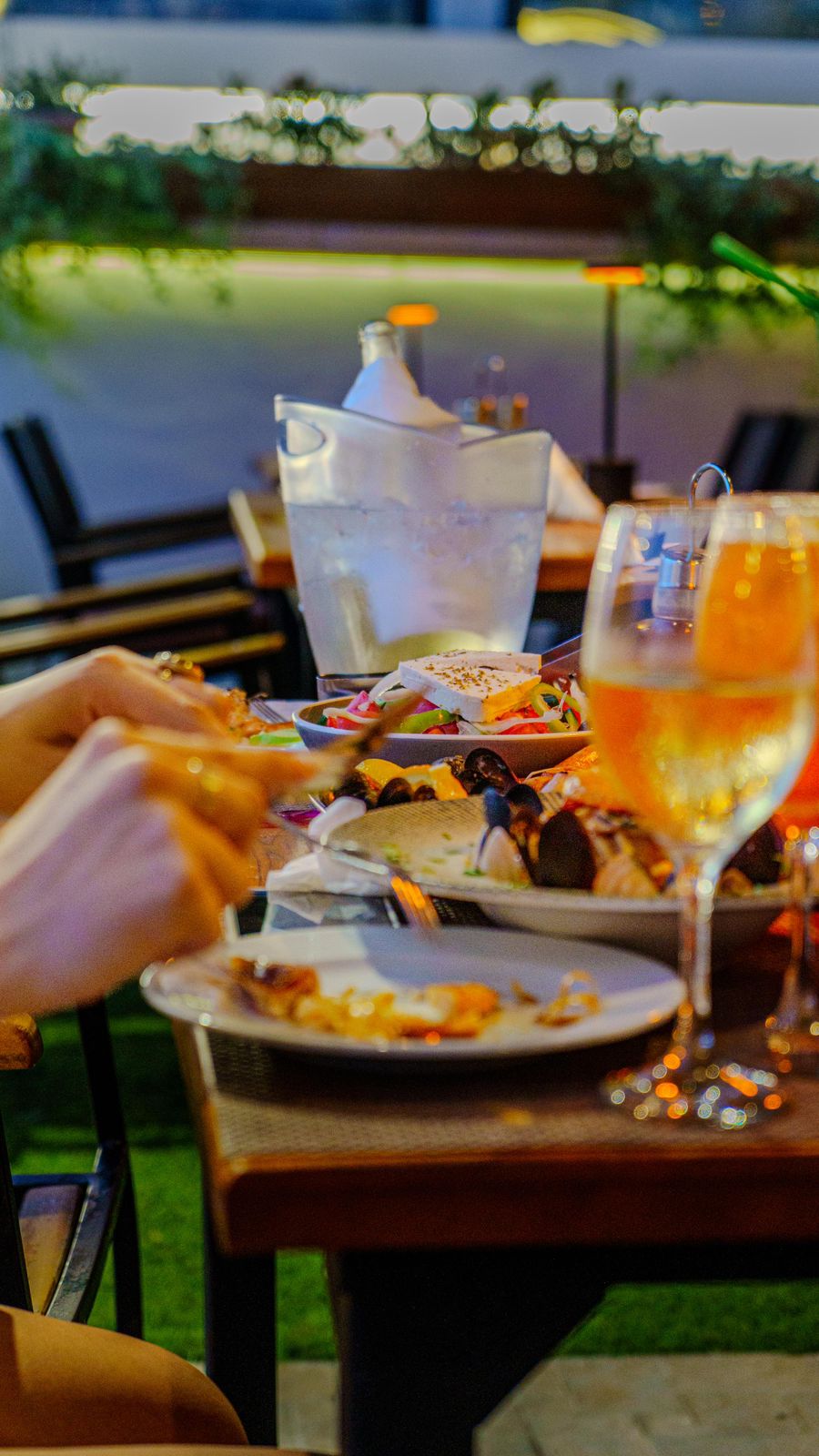 Mediterranean table with feta, salad and grilled fish